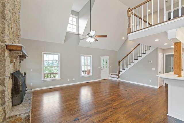 1055 Wades Branch Rd, Centerville, TN 37033 - unfurnished living room featuring a high ceiling, ceiling fan, wood finished floors, stairs, and healthy amount of natural light