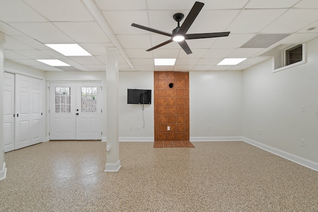 interior space with french doors, a paneled ceiling, and ceiling fan