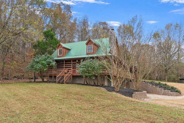 1055 Wades Branch Rd, Centerville, TN 37033 - back of house with stairway, a chimney, a yard, metal roof, and a porch