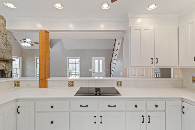 1055 Wades Branch Rd, Centerville, TN 37033 - kitchen with black electric cooktop, a ceiling fan, white cabinets, a peninsula, and light countertops