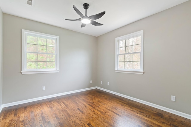 1055 Wades Branch Rd, Centerville, TN 37033 - spare room with baseboards, dark wood-type flooring, and a ceiling fan