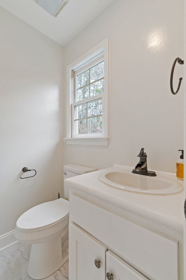 bathroom with vanity and toilet