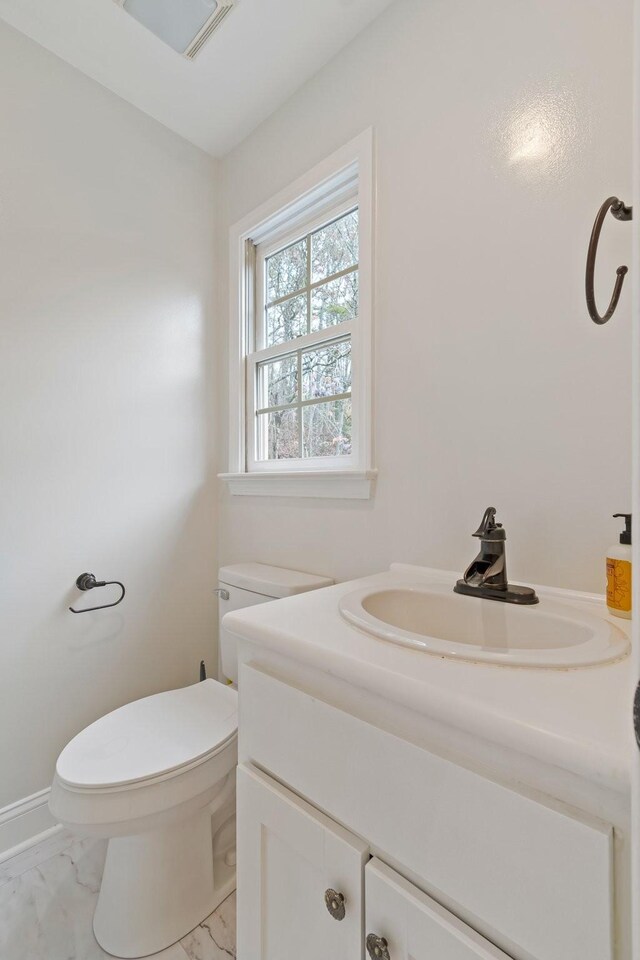 1055 Wades Branch Rd, Centerville, TN 37033 - half bath featuring marble look tile flooring, toilet, and vanity