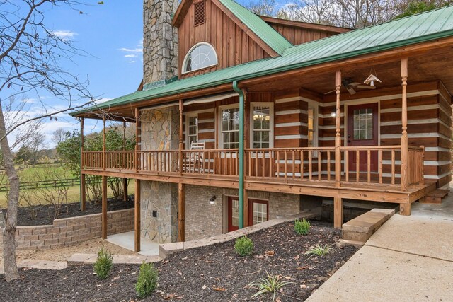1055 Wades Branch Rd, Centerville, TN 37033 - view of side of property featuring metal roof and stone siding