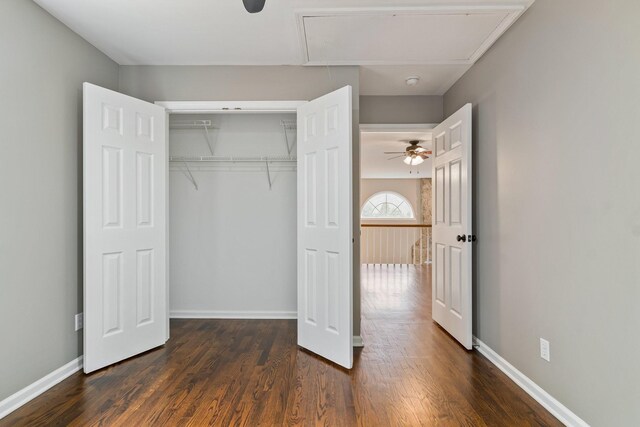 1055 Wades Branch Rd, Centerville, TN 37033 - unfurnished bedroom with attic access, dark wood-style flooring, a closet, and baseboards