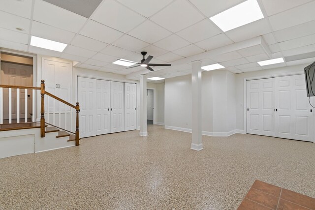 1055 Wades Branch Rd, Centerville, TN 37033 - below grade area featuring baseboards, ceiling fan, a drop ceiling, and stairs