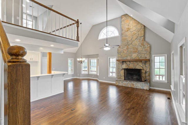 unfurnished living room with plenty of natural light and high vaulted ceiling