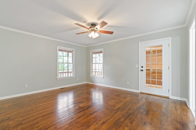 spare room featuring ceiling fan, crown molding, and dark wood-type flooring