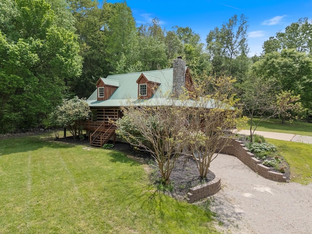 1055 Wades Branch Rd, Centerville, TN 37033 - view of property exterior with stairs, a chimney, a yard, and metal roof