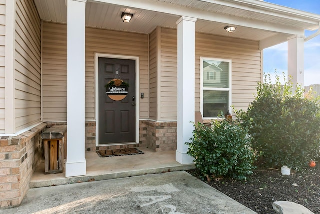 doorway to property with covered porch