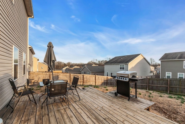 wooden deck with grilling area