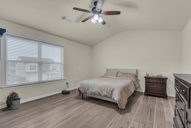 bedroom featuring vaulted ceiling, light hardwood / wood-style flooring, and ceiling fan