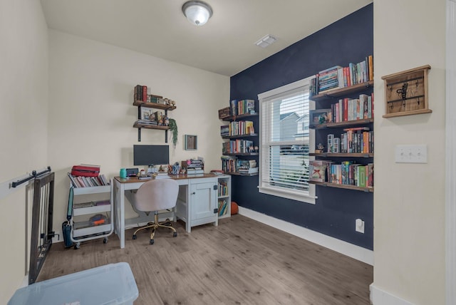 home office featuring light hardwood / wood-style floors