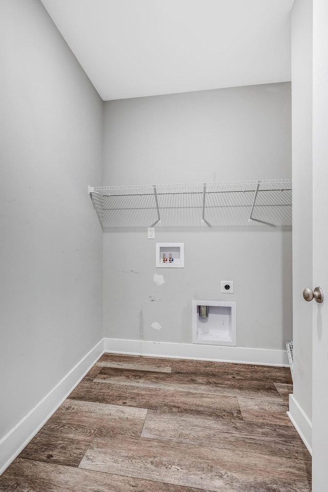 clothes washing area with hookup for an electric dryer, wood-type flooring, and washer hookup