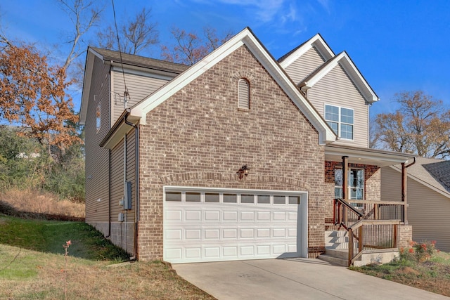 front of property featuring a porch and a garage