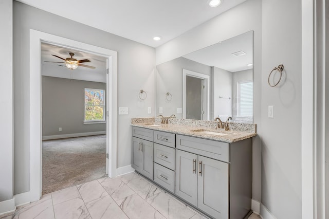 bathroom featuring ceiling fan and vanity