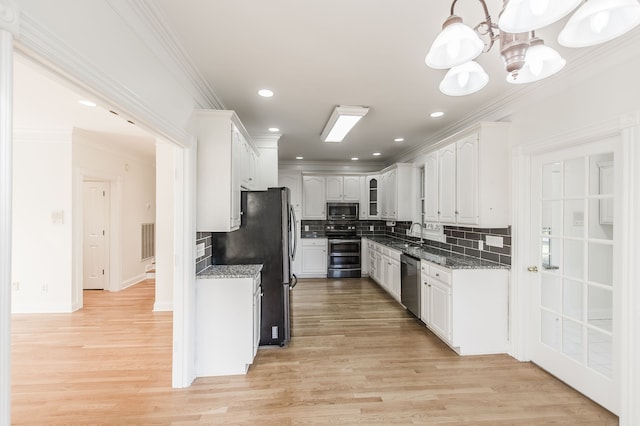 kitchen with white cabinetry, stainless steel appliances, light hardwood / wood-style flooring, decorative backsplash, and ornamental molding