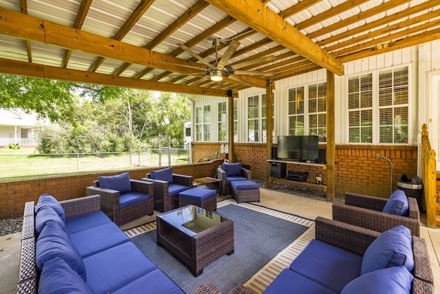 view of patio with outdoor lounge area and ceiling fan