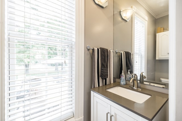 bathroom featuring vanity and crown molding