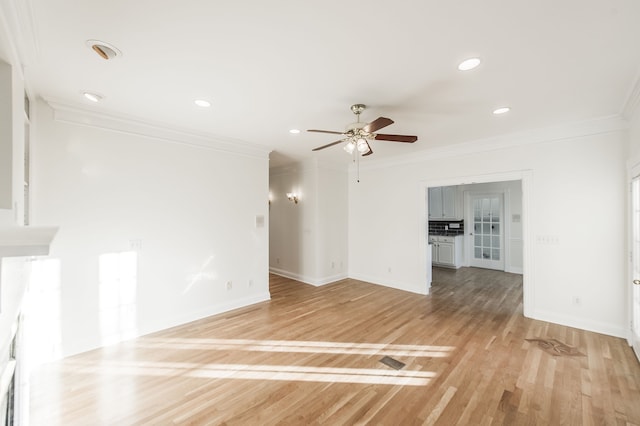 unfurnished living room with ceiling fan, light hardwood / wood-style floors, and ornamental molding