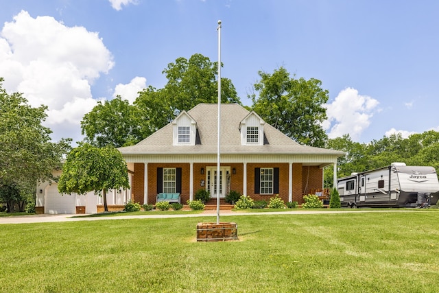 cape cod house with a porch, a garage, and a front lawn