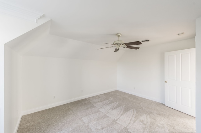 bonus room with ceiling fan, light colored carpet, and lofted ceiling