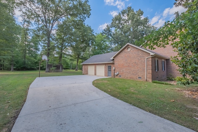 view of property exterior featuring a garage and a yard