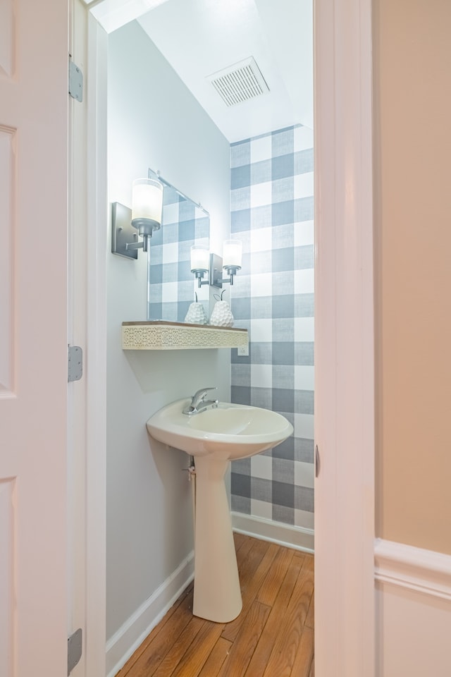 bathroom featuring hardwood / wood-style flooring