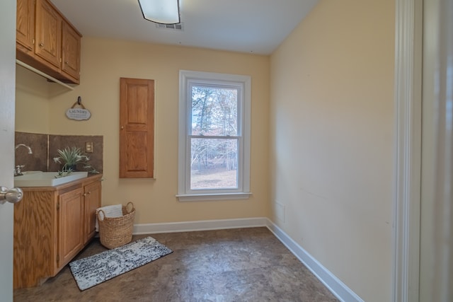 bathroom with sink and concrete floors