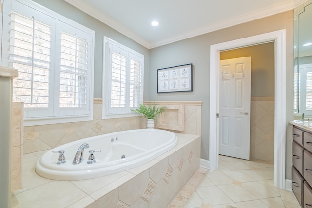 bathroom with tile patterned floors, vanity, a relaxing tiled tub, and ornamental molding