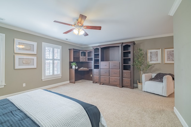 bedroom with ceiling fan, ornamental molding, and light carpet