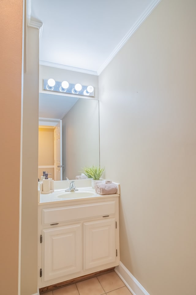 bathroom featuring vanity, tile patterned floors, and ornamental molding