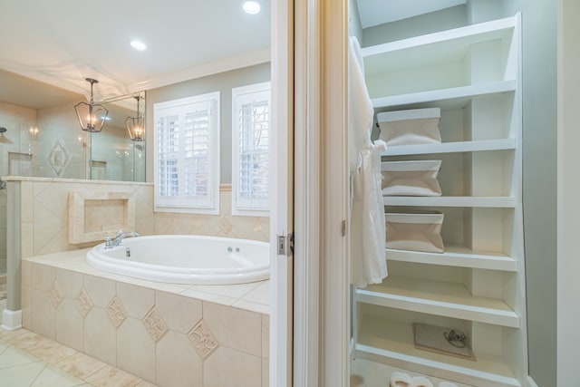 bathroom with independent shower and bath, tile patterned floors, and a notable chandelier