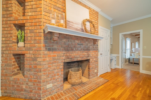 unfurnished living room with wood-type flooring and crown molding