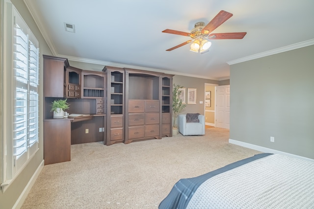 carpeted bedroom with ceiling fan and crown molding