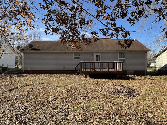 back of house featuring a wooden deck