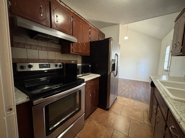 kitchen with sink, decorative light fixtures, decorative backsplash, light tile patterned floors, and appliances with stainless steel finishes