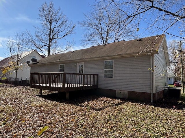 back of property featuring a wooden deck