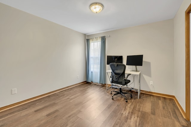 office area with hardwood / wood-style floors