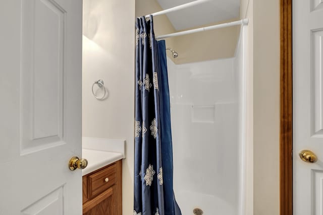 bathroom featuring vanity and a shower with shower curtain