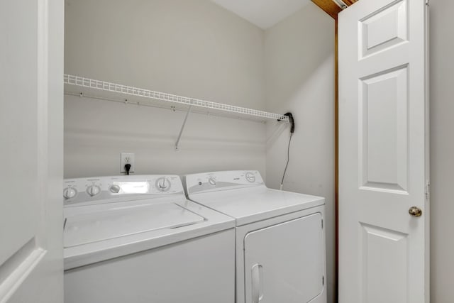 laundry room with washer and dryer