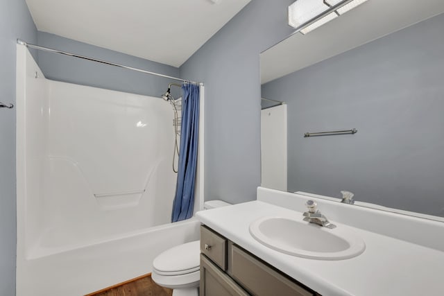 full bathroom featuring shower / tub combo with curtain, vanity, wood-type flooring, and toilet