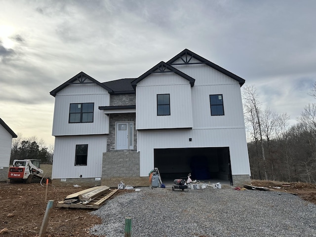 view of front facade featuring a garage, driveway, and crawl space