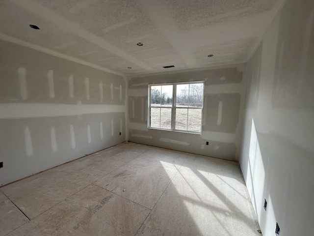 spare room featuring visible vents