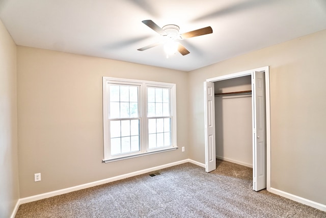 unfurnished bedroom featuring carpet flooring, a closet, and ceiling fan