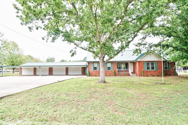 single story home with a carport, covered porch, and a front yard