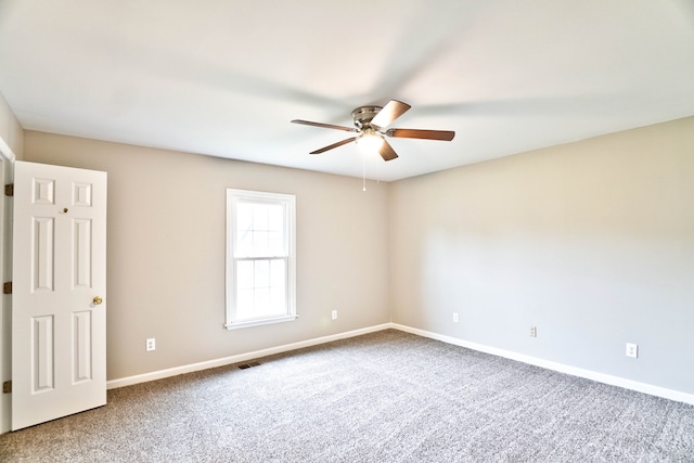 carpeted empty room with ceiling fan