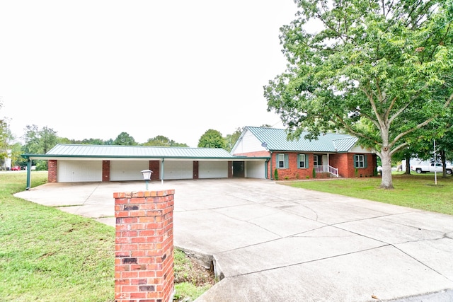 single story home featuring a carport and a front yard