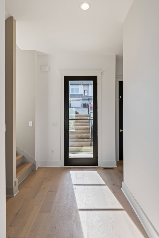 foyer entrance featuring light wood-type flooring