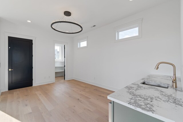 interior space with light wood-type flooring and sink